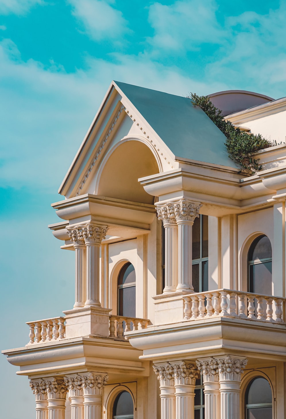 Classical architectural facade with columns and arched windows