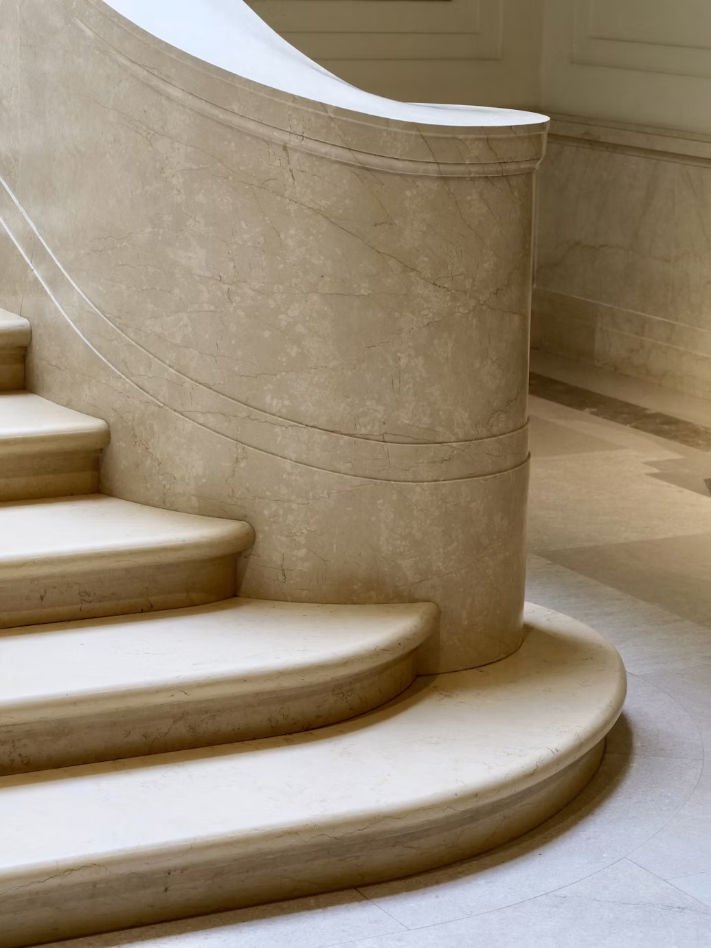 Curving stone staircase in a refined interior